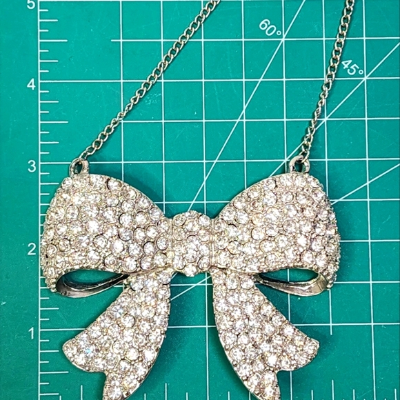 Fashion Forward Large Rhinestone and Silver Bow Pendant Necklace - Picture 7 of 11
